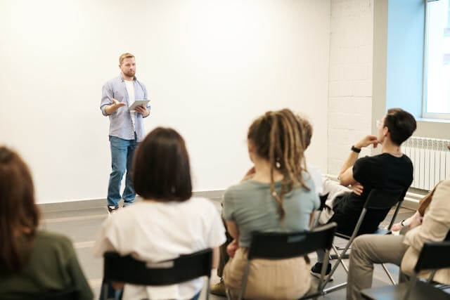 Students engaging in a dynamic public speaking class at Erican Language Centre, Kuala Lumpur.